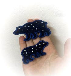 FSL bear-shaped pieces in dark blue fabric with sparkling embellishments, showcasing a playful design.