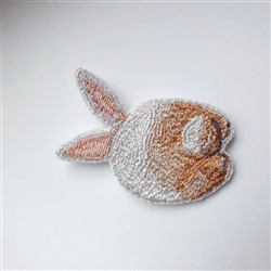 FSL fish with a round body in vibrant orange and white, featuring playful fins and textured embroidery.