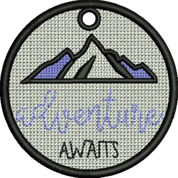 FSL mountains patch featuring stylized purple peaks and 'adventure awaits' text, set in a playful circular design.