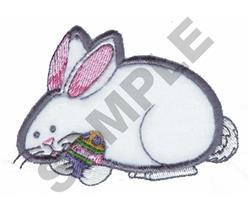 Applique rabbit with white fur and pink-tipped ears holding a colorful Easter egg, perfect for festive decor.