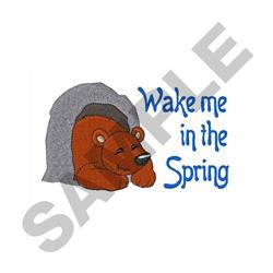 Playful bear nestled in a cozy gray cave with blue text 'Wake me in the Spring', evoking a whimsical spring feel.