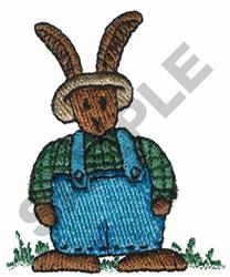 Playful rabbit in straw hat and blue overalls stands on grass, perfect for Easter-themed projects.