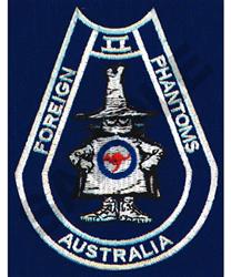 Cartoonish phantom character in a hat with hands on hips, 'FOREIGN PHANTOMS' text in bold white against dark blue.