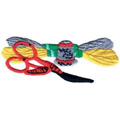 Red scissors alongside a vibrant green spool and yellow, grey embroidery floss in a playful arrangement.