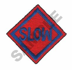 SLOW diamond patch features a bold red background, blue outline, and prominent blue text, creating an eye-catching cautionary