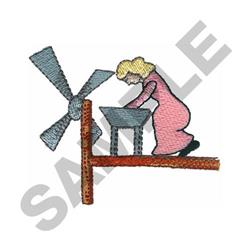 Whimsical scene featuring a woman with blonde hair in a pink dress, working at a table beside a colorful windmill.
