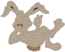 Playful rabbit in light tan color with fluffy texture, lying on its back for Easter celebrations.