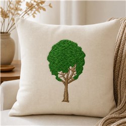 Naturalistic green tree embroidered on a beige cushion, featuring detailed brown trunk and lush foliage.