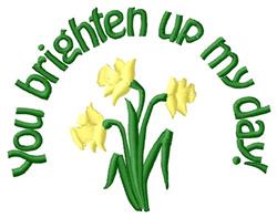 Playful daffodils with bright yellow blooms and green stems, surrounded by curved text saying 'you brighten up my day' in spr