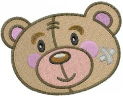 Cartoon bear head with pink cheeks and a band-aid, showcasing a cheerful expression in soft colors. Ideal for machine embroid