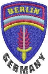 Applique embroidered patch showcasing a vibrant shield with 'BERLIN' in yellow, a pink sword, and rainbow stripes.