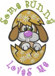 Playful bunny peeking from a cracked egg adorned with flowers, featuring vibrant 'Some Bunny Loves Me' text for Easter.