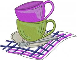 Stack of two colorful coffee cups—purple and green—on a round saucer, with a spoon on a vibrant plaid tablecloth.