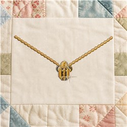Gold zipper design with a shiny finish on a quilted background, framed by colorful pastel patchwork.