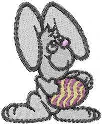 Playful grey rabbit with large ears holding a colorful striped Easter egg, perfect for festive decor.
