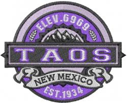 Textual badge patch featuring 'TAOS' in bold purple and black, with ribbons and mountains, vintage outdoor theme.