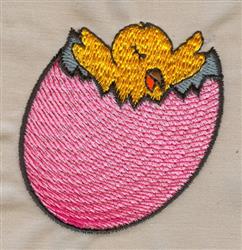 Colorful chick in pink eggshell with bright details, perfect for festive Easter decor.
