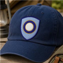 Navy cap with a circular shield emblem, featuring bold contrasting colors, perfect for outdoor style.