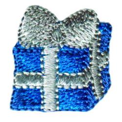 Colorful gift box with a silver bow, featuring detailed stitching and a festive blue design for holiday celebrations.