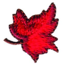 Vibrant red maple leaf with intricate textured embroidery, showcasing autumnal beauty and natural curves.