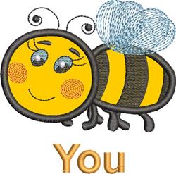 Applique bee with a joyful smile, vibrant yellow body, fluffy blue wings, and the text 'You' below.