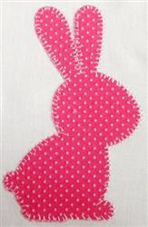 Applique pink bunny silhouette with polka dot fabric and white stitching, perfect for festive Easter decor.