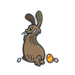 Cartoonish brown rabbit with large ears, playful expression, and colorful eggs, perfect for Easter.