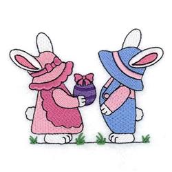 Playful bunny design with a pink bunny holding an Easter egg, dressed in colorful outfits, set in spring-themed grass.