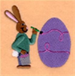 Playful bunny painting a purple egg with pink swirls, wearing green sweater and grey pants. Perfect for Easter decor.