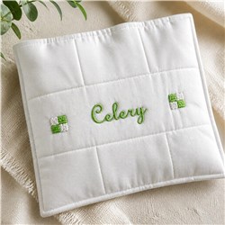 Modern text reading 'Celery' in vibrant green thread on clean white fabric, flanked by green squares.