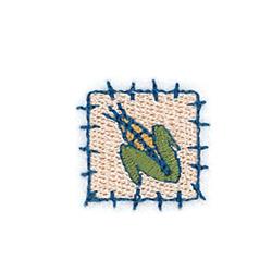 Playful corn cob with green and yellow details beside a charming frog, outlined in blue stitching.