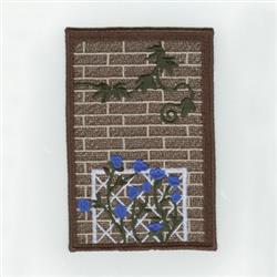 FSL brick wall adorned with vibrant blue flowers and intricate ivy leaves, showcasing textured details.