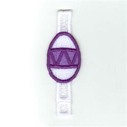 FSL embroidered egg in vibrant purple and white, featuring playful triangles and lines, ideal for Easter decor.
