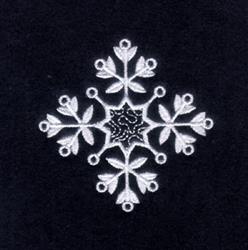 FSL snowflake design with intricate white thread details and stylized floral elements on a black background.