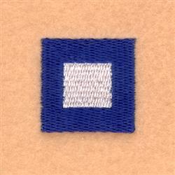 Square patch with navy blue background and white center square. Simple geometric design on beige surface.