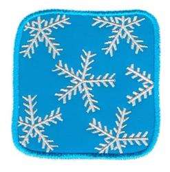 Applique snowflake with intricate details on a bright blue background, perfect for cheerful winter decor.