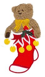 Playful bear with a yellow bow in a red Christmas stocking, adorned with yellow ornaments and green leaves.