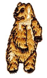 Realistic standing bear in golden-brown with intricate fur textures and shading on a plain background.