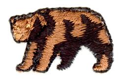 Realistic bear portrait in brown and black threads, featuring a textured appearance against a plain background.