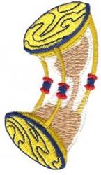 Colorful drum in yellow and brown with intricate patterns, accented by playful red edges, perfect for vibrant embroidery.