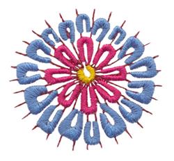 Colorful flower motif with blue and pink shades, featuring a bright yellow center and rich texture.