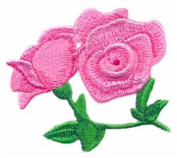 Pink roses with soft, curved petals and lush green leaves, showcasing vibrant colors in a floral design.