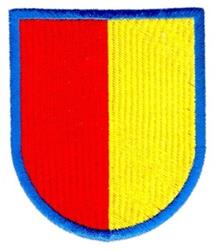 Applique shield-shaped emblem featuring bold red and yellow halves with a vibrant blue border.