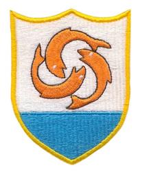 Modern shield emblem featuring three orange fish in a flowing pattern, white shield with blue bottom, bold yellow outline.