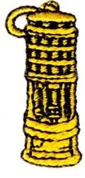 Embroidery spool in bold yellow with black details, textured, and cylindrical, ideal for modern sewing projects.