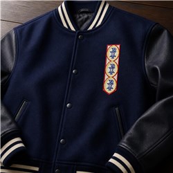 Varsity jacket with navy fabric and leather sleeves, featuring a gold and red embroidered patch, ideal for fall.