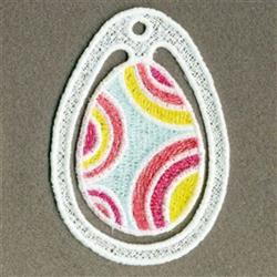 FSL Easter egg with vibrant pink, yellow, and blue swirling patterns on dark fabric, playful and festive.