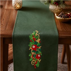Festive green table runner with red ornaments and gold accents, perfect for Christmas decor.