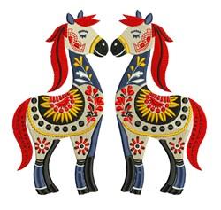 Whimsical decorative horses facing each other, adorned with intricate floral patterns in vibrant reds, yellows, and blues.