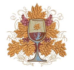 Elegant wine glass filled with dark liquid, surrounded by purple grapes and golden leaves for fall decor.